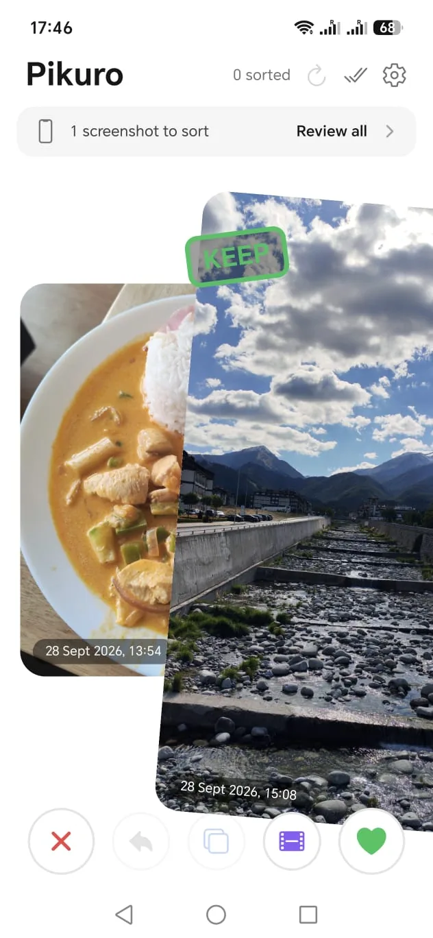 Pikuro's sorter: a mountain photo swiped right and stamped KEEP, the next photo waiting underneath.